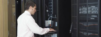 Technician working in server room